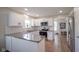 Modern kitchen with white cabinets, stainless steel appliances, granite countertops, and subway tile backsplash at 13074 Lansdowne Dr, Fishers, IN 46038