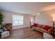 Bright living room featuring hardwood floors and comfortable seating arrangements at 13074 Lansdowne Dr, Fishers, IN 46038