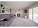 Inviting living room boasts a cozy fireplace and sliding doors to the patio at 13074 Lansdowne Dr, Fishers, IN 46038