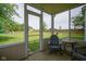 Enclosed patio offering views of the expansive backyard, perfect for relaxing at 13074 Lansdowne Dr, Fishers, IN 46038