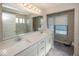 Bathroom with double sink vanity, large mirror, and walk-in shower at 13301 Minden Dr, Fishers, IN 46037