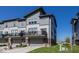 Modern townhouse complex featuring gray siding, private balconies, and well-maintained landscaping at 13301 Minden Dr, Fishers, IN 46037