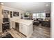 A spacious living room with bar, gray sofa set, and sports decor for entertaining at 13301 Minden Dr, Fishers, IN 46037