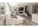 The stylish living room has a fireplace, wall-mounted TV, and large comfortable sectional at 13301 Minden Dr, Fishers, IN 46037