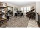 Office and music area with desk, piano, exercise equipment, and neutral decor at 13301 Minden Dr, Fishers, IN 46037