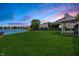 Spacious backyard overlooking a peaceful pond, perfect for outdoor relaxation and enjoying nature's beauty at 14052 Rayners Ln, Fishers, IN 46037