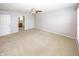 Spacious bedroom featuring plush carpet, neutral walls, and a ceiling fan at 14052 Rayners Ln, Fishers, IN 46037
