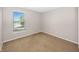 Bedroom with neutral paint, carpeted floors, and a bright window with view at 14052 Rayners Ln, Fishers, IN 46037