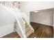 Bright entryway features wood-look flooring, stairs to the upper level, and white wainscoting details at 14052 Rayners Ln, Fishers, IN 46037