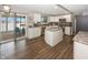 Bright kitchen featuring white cabinets, granite countertops, stainless steel appliances and a center island at 14052 Rayners Ln, Fishers, IN 46037