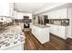 Open concept kitchen featuring white cabinets, stainless steel appliances and a center island at 14052 Rayners Ln, Fishers, IN 46037