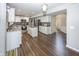 Open concept kitchen featuring white cabinets, stainless steel appliances and a center island at 14052 Rayners Ln, Fishers, IN 46037