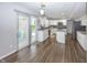 Bright kitchen featuring white cabinets, granite countertops, stainless steel appliances and sliding patio door at 14052 Rayners Ln, Fishers, IN 46037