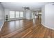 Open living room featuring a sliding glass doors, a ceiling fan and wood-look flooring at 14052 Rayners Ln, Fishers, IN 46037