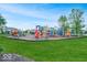 Community playground featuring various play structures, slides, and climbing areas at 14052 Rayners Ln, Fishers, IN 46037