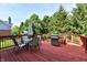Relaxing outdoor living space featuring a spacious deck, patio furniture, barbecue grill, and backyard at 14082 Brazos Dr, Carmel, IN 46033