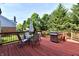 Relaxing outdoor living space featuring a spacious deck, patio furniture, barbecue grill, and backyard at 14082 Brazos Dr, Carmel, IN 46033