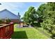 Backyard features a playset, privacy fence, and mature trees for a Gathering-friendly and relaxing outdoor space at 14082 Brazos Dr, Carmel, IN 46033