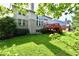 Expansive backyard featuring a deck, playset, and lush lawn, perfect for outdoor entertaining and Gathering activities at 14082 Brazos Dr, Carmel, IN 46033