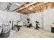 Unfinished basement area currently being used as a home gym and featuring exposed ceiling at 14082 Brazos Dr, Carmel, IN 46033