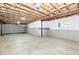 Unfinished basement featuring concrete walls, floors, and exposed ceiling with a small window letting in natural light at 14082 Brazos Dr, Carmel, IN 46033