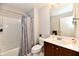 Cozy bathroom offers a shower over bath and a vanity with storage space at 14082 Brazos Dr, Carmel, IN 46033