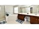 Primary bathroom offers double sink vanity, soaking tub, glass shower, and linen closet at 14082 Brazos Dr, Carmel, IN 46033