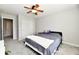Bedroom featuring neutral decor, closet, ceiling fan and large window at 14082 Brazos Dr, Carmel, IN 46033