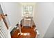 Grand two-story foyer with hardwood floors, a decorative chandelier, and a striking staircase with wooden railing at 14082 Brazos Dr, Carmel, IN 46033