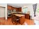 Open kitchen features a center island, stainless steel appliances, and granite countertops at 14082 Brazos Dr, Carmel, IN 46033