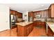 Modern kitchen features stainless steel appliances, granite countertops, and hardwood floors at 14082 Brazos Dr, Carmel, IN 46033