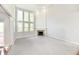 Living room with fireplace, large windows, and neutral paint at 14082 Brazos Dr, Carmel, IN 46033
