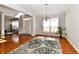 Open living room with hardwood floors, decorative rug, and natural light at 14082 Brazos Dr, Carmel, IN 46033