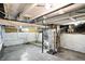 Spacious basement featuring painted walls, exposed ductwork, and concrete flooring providing a functional space at 1430 W 14Th St, Anderson, IN 46016