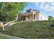 Charming single Gathering home featuring a landscaped front yard and inviting front porch at 1430 W 14Th St, Anderson, IN 46016