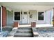 Close up front porch view with white door and brick columns at 1430 W 14Th St, Anderson, IN 46016