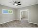 Living room featuring neutral walls, wood floors, and ceiling fan at 1430 W 14Th St, Anderson, IN 46016