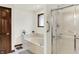Bathroom featuring a soaking tub, glass shower, and dark wood trim at 1456 Bent Tree Pl, Greenwood, IN 46143