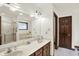 Well-lit bathroom with double sinks, a large mirror, and separate shower and bathtub at 1456 Bent Tree Pl, Greenwood, IN 46143