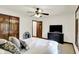 Comfortable bedroom featuring a ceiling fan, door, and modern furniture at 1456 Bent Tree Pl, Greenwood, IN 46143