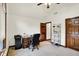 Bedroom features neutral carpet, a desk, vaulted ceilings, and a ceiling fan at 1456 Bent Tree Pl, Greenwood, IN 46143