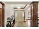 Inviting entryway showcasing hardwood floors, decorative wood trim, and a stylish console table at 1456 Bent Tree Pl, Greenwood, IN 46143
