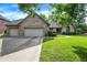 Well-maintained brick home with a three-car garage, lush lawn, and inviting curb appeal at 1456 Bent Tree Pl, Greenwood, IN 46143