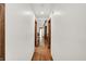Bright hallway featuring wood floors, recessed lighting, and neutral-colored walls at 1456 Bent Tree Pl, Greenwood, IN 46143