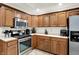 Kitchen features stainless steel appliances, light countertops and ample cabinet space at 1456 Bent Tree Pl, Greenwood, IN 46143