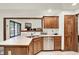 Kitchen featuring tile floors, a stainless steel dishwasher, and a large island with seating at 1456 Bent Tree Pl, Greenwood, IN 46143