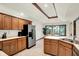 Kitchen boasts stainless steel appliances, tile floors, wooden cabinets, and a breakfast nook at 1456 Bent Tree Pl, Greenwood, IN 46143