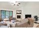 Inviting living area featuring plush seating, a cozy fireplace, and large windows for natural light at 1456 Bent Tree Pl, Greenwood, IN 46143