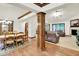 Spacious living area featuring hardwood floors, a fireplace, and an open layout connected to the dining area at 1456 Bent Tree Pl, Greenwood, IN 46143