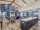 Spacious clubhouse interior featuring a full kitchen, dining tables, a fireplace, and ample seating areas at 1563 Adios Butler Ct, Danville, IN 46122